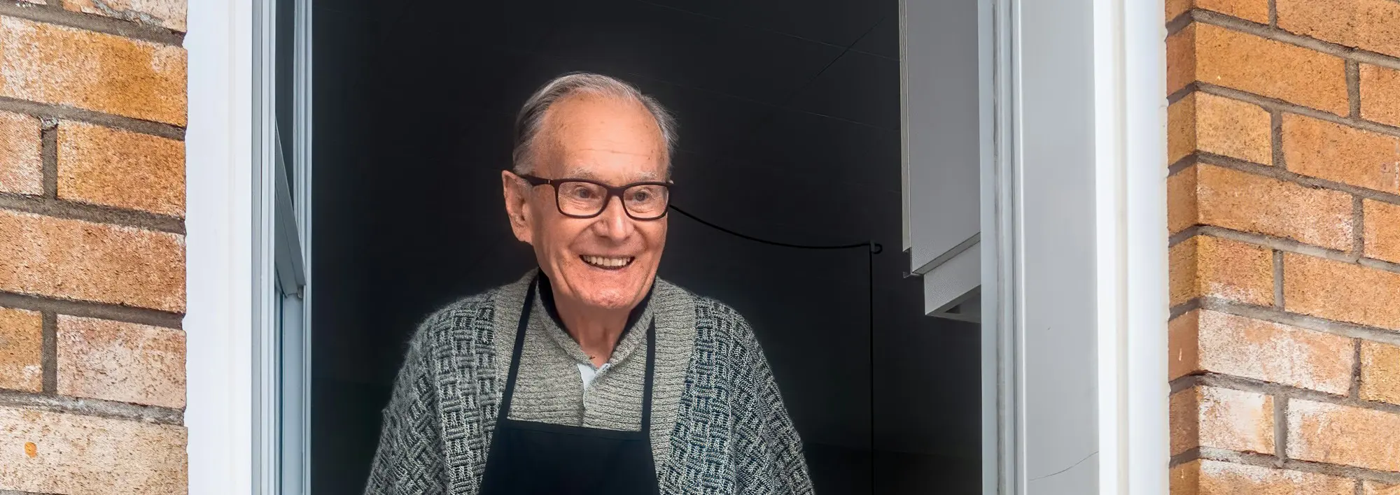 Smiley Older Man Opening Door Andre Ouellet