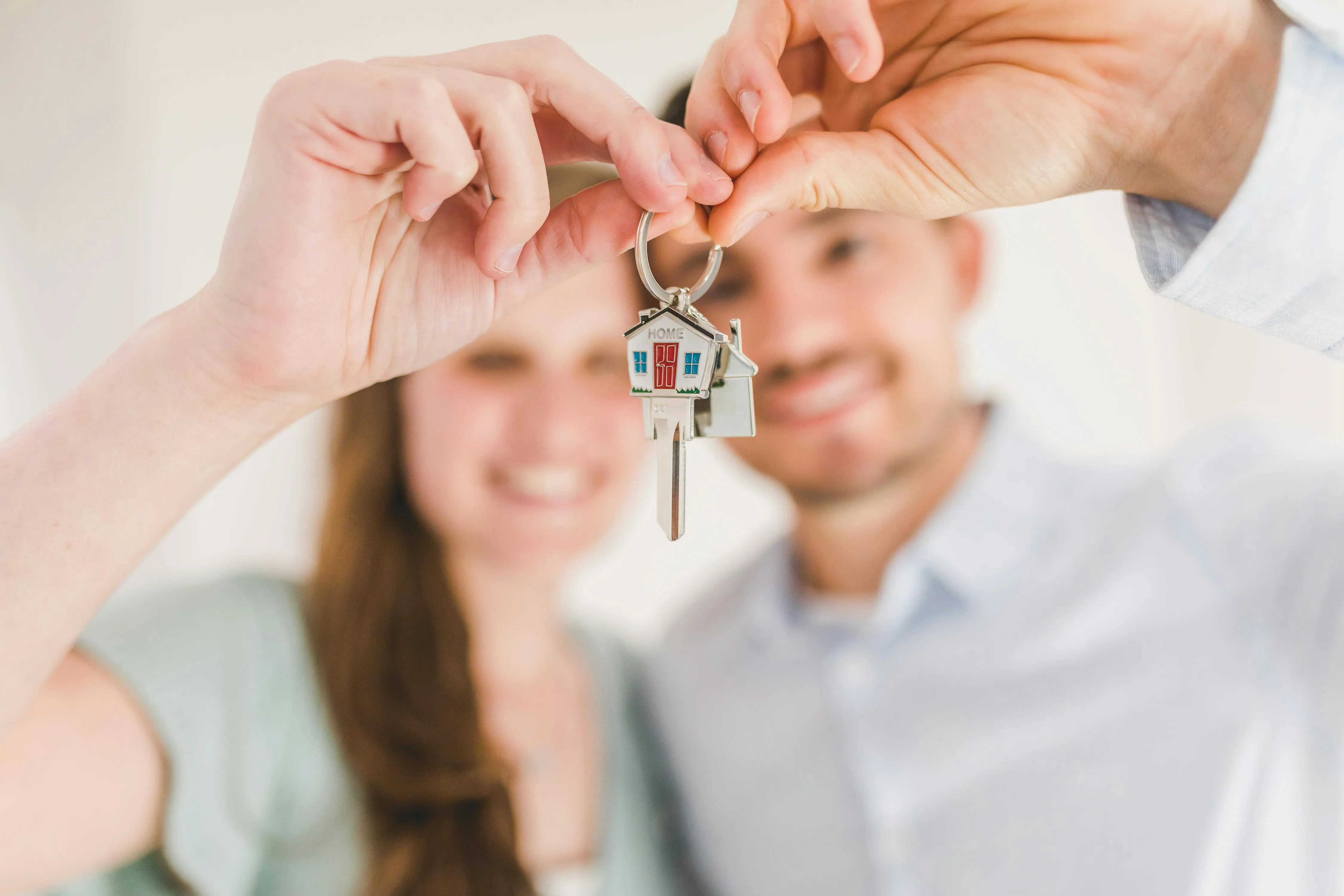 Blurred Image Of Couple Holding House Keys Rdn