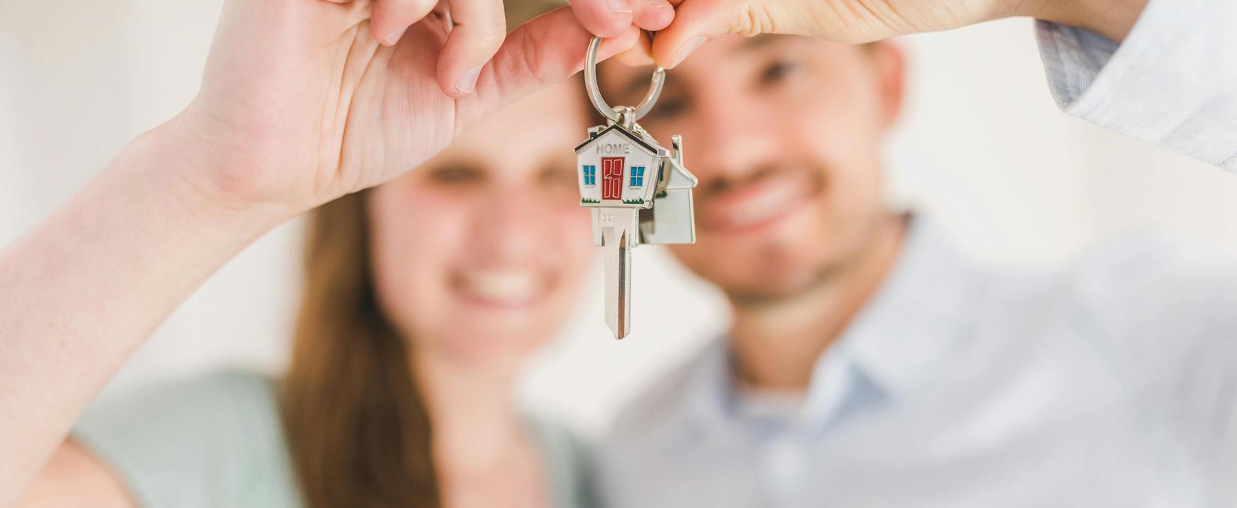 Blurred Image Of Couple Holding House Keys Rdn